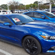 My former Focus is hiding behind the beast that is the new Mustang...